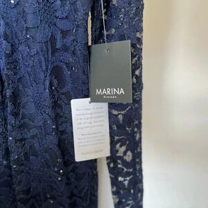 Marina size small new with tags! Blue lace and never worn. Long-sleeve.